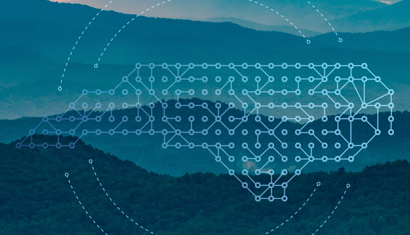 landscape with an outline of a map of north carolina over it